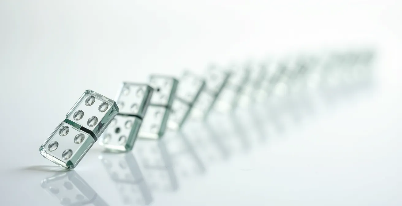 Dominoeffekt medizinischer Untersuchungen dargestellt durch fallende Glasblöcke